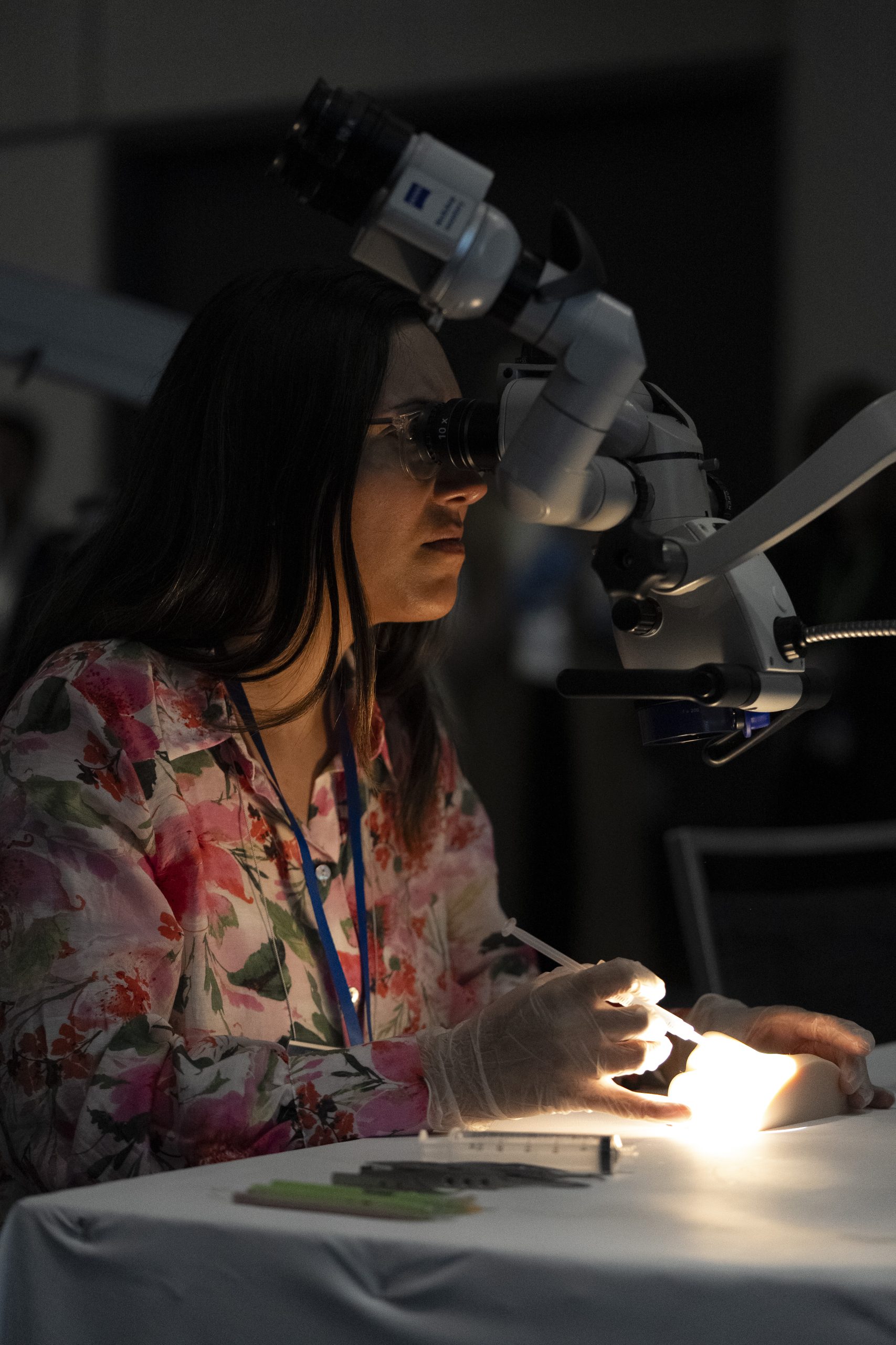 Ophthalmologist at workstation with ophthalmic equipment