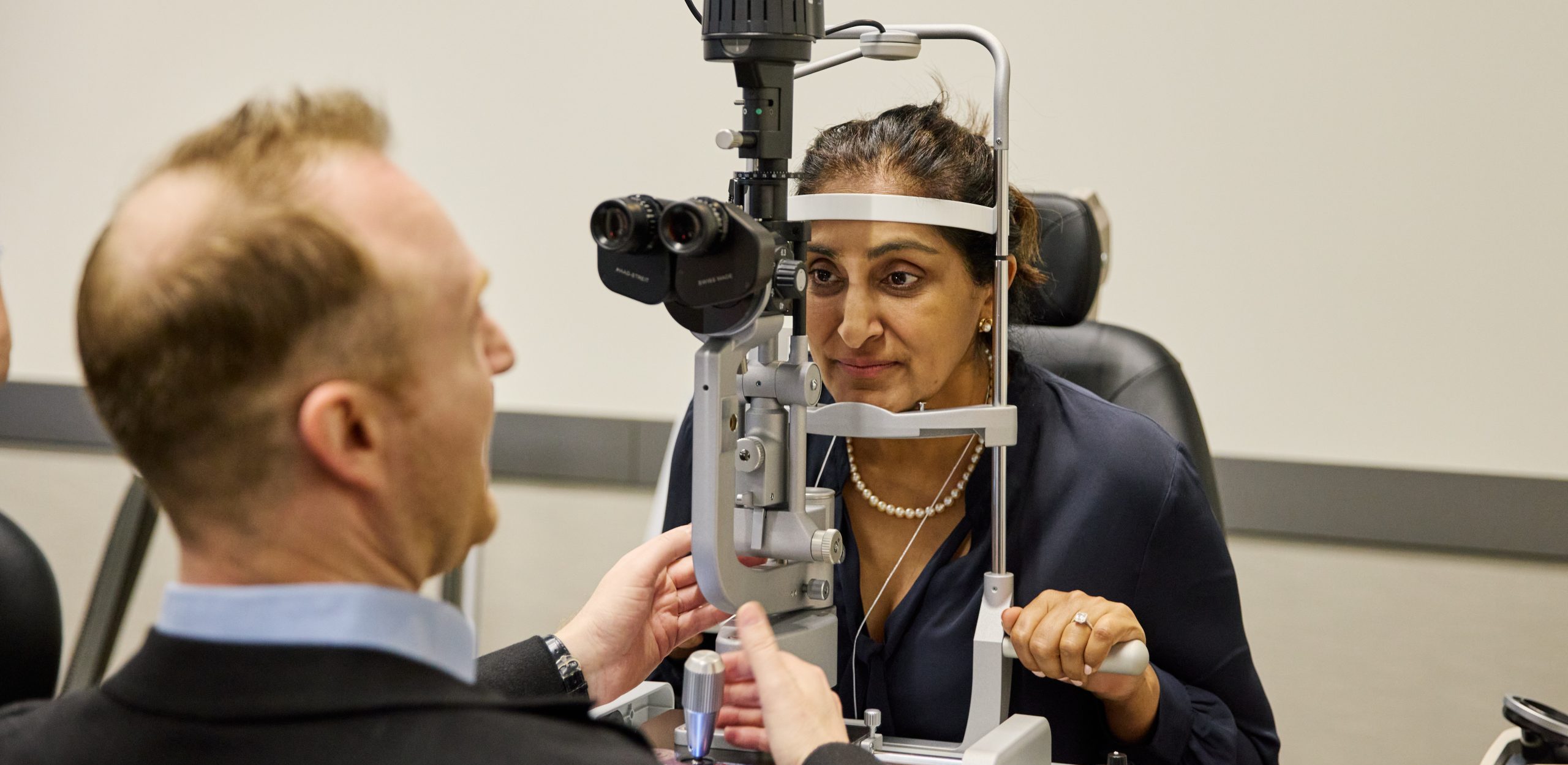 Ophthalmologist in a clinical setting with equipment